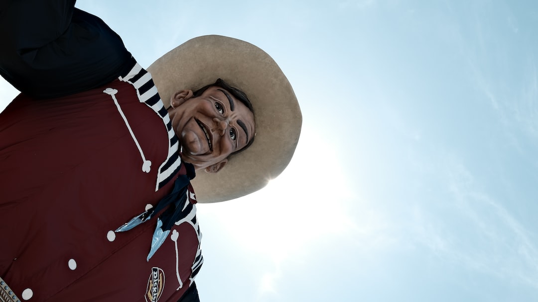 a man wearing a hat and a red jacket 2