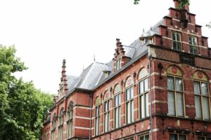 brown brick building under white sky during daytime