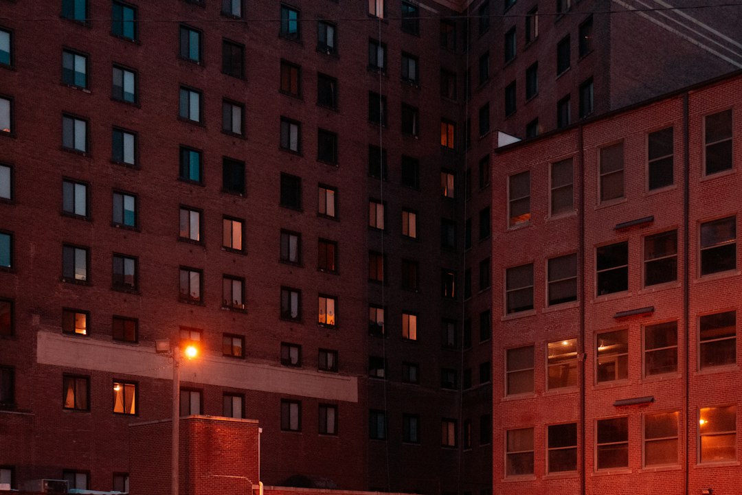 a red brick building with a street light in front of it