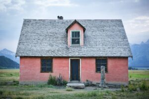 red and gray brick house under gray sky